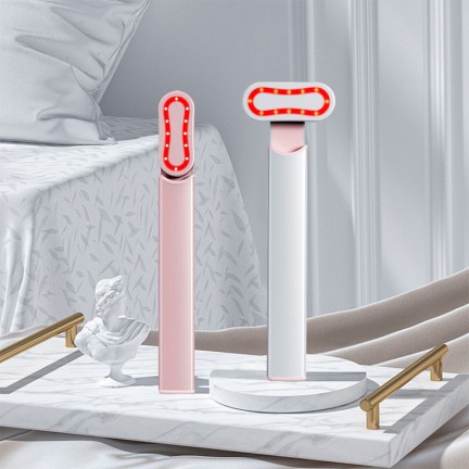 Rotating heated eye revitalizing massage stick